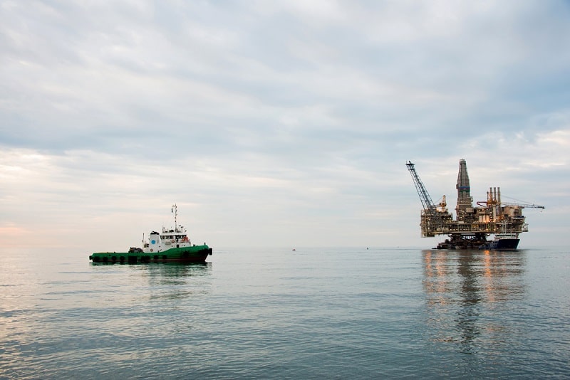 Oil rig being towed into the sea